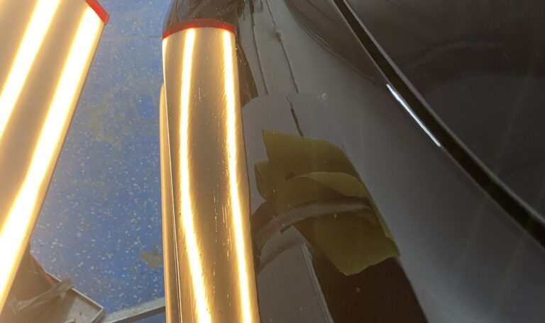 Front fender body line after paintless dent repair