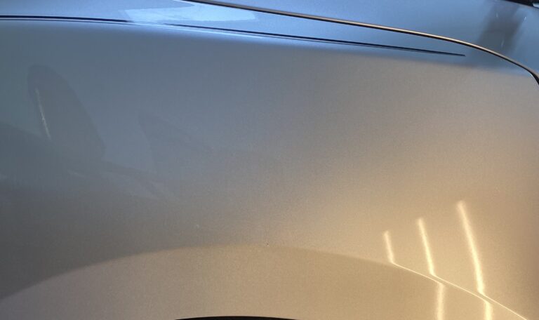 Silver fender after paintless dent repair